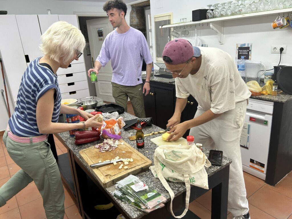 Momo, Adri and Hannah preparing food. May 2023