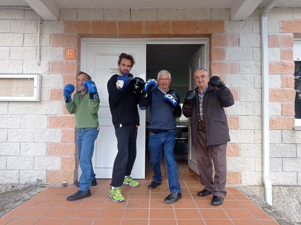 Victor and villagers after a boxing training